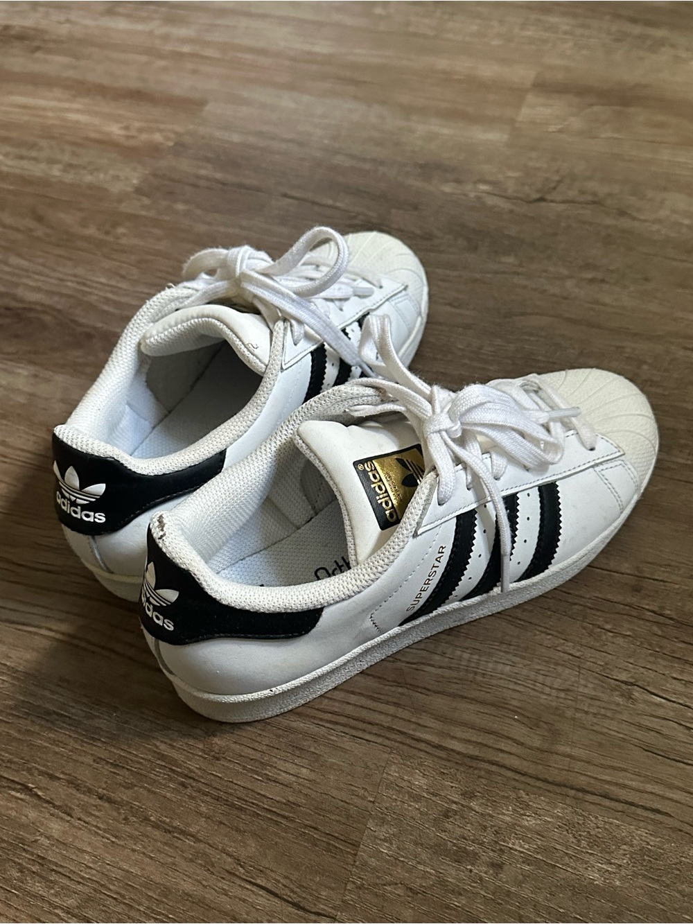 Adidas Superstar White Sneakers  Classic Black Stripes and Gold Tongue Detail